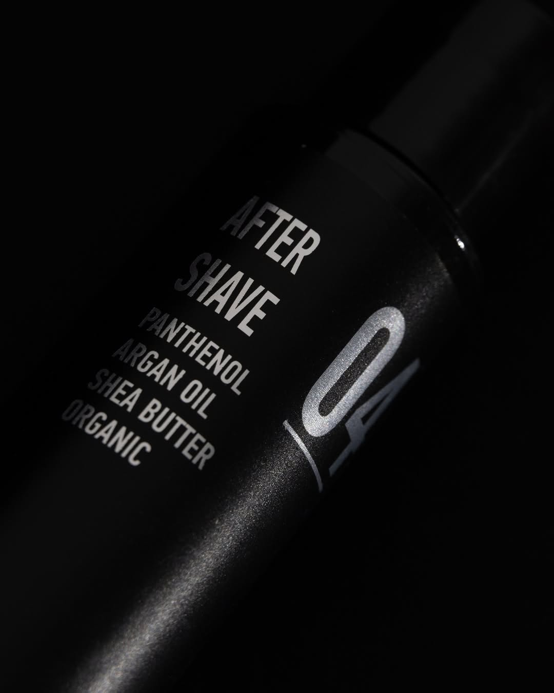 Person wearing white hoodie and bucket hat facing away.